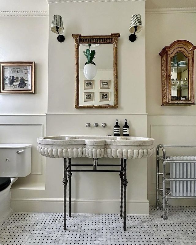 Example of bathroom in European vintage style of how to mix metals when decorating