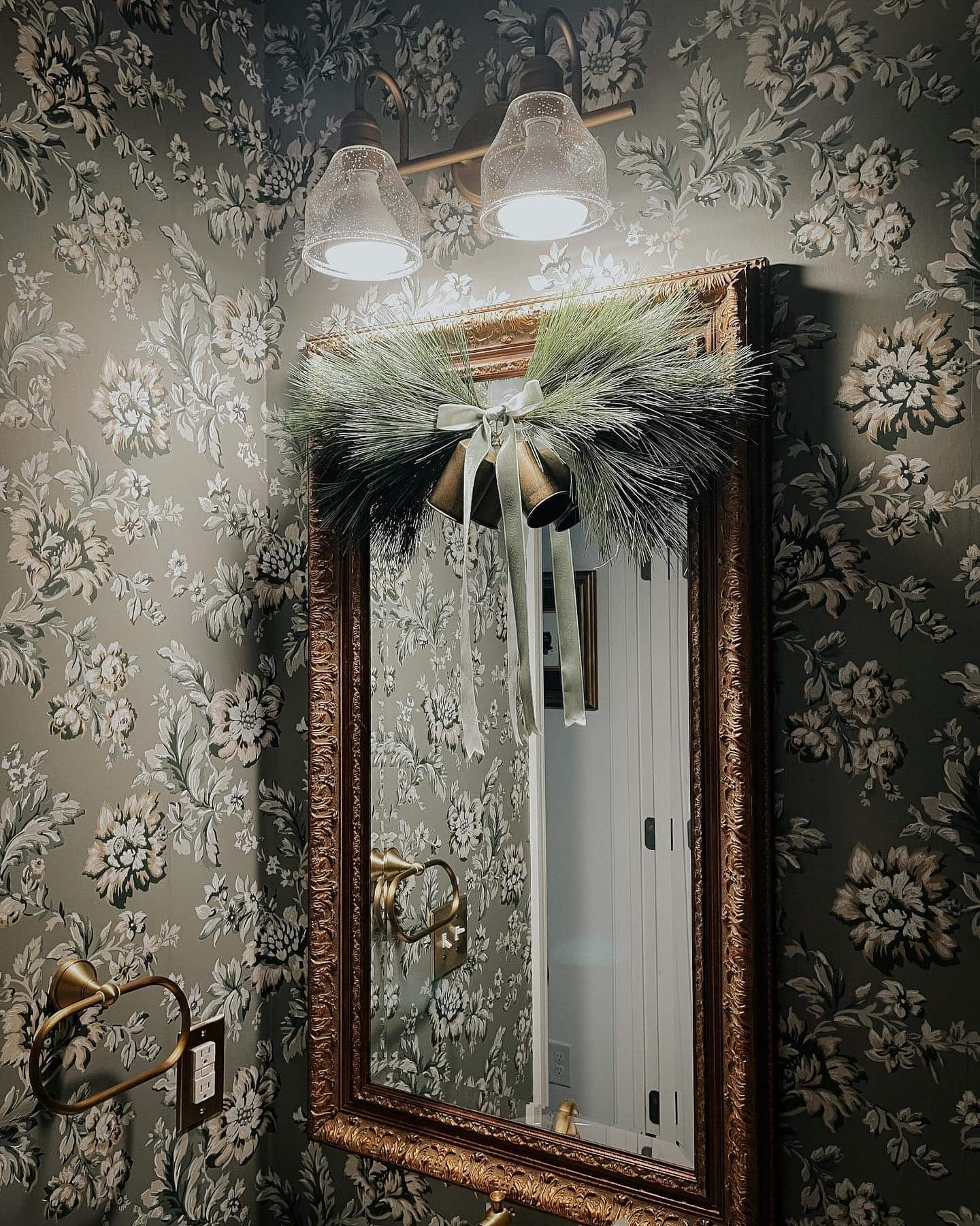 Ideas and tips for Christmas bathroom decor featuring a bathroom with traditional style, showcasing a patterned wallpaper in muted light blue and white.