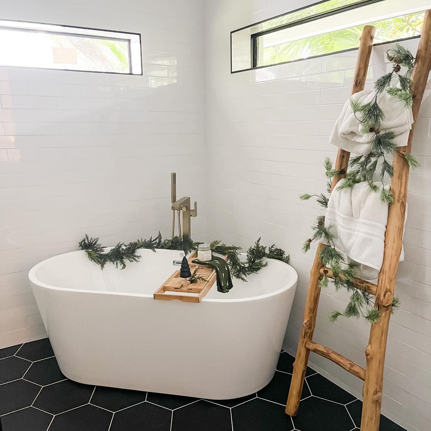 Ideas and tips for Christmas bathroom decor featuring a bathroom with elegant style, showcasing Christmas garlands.