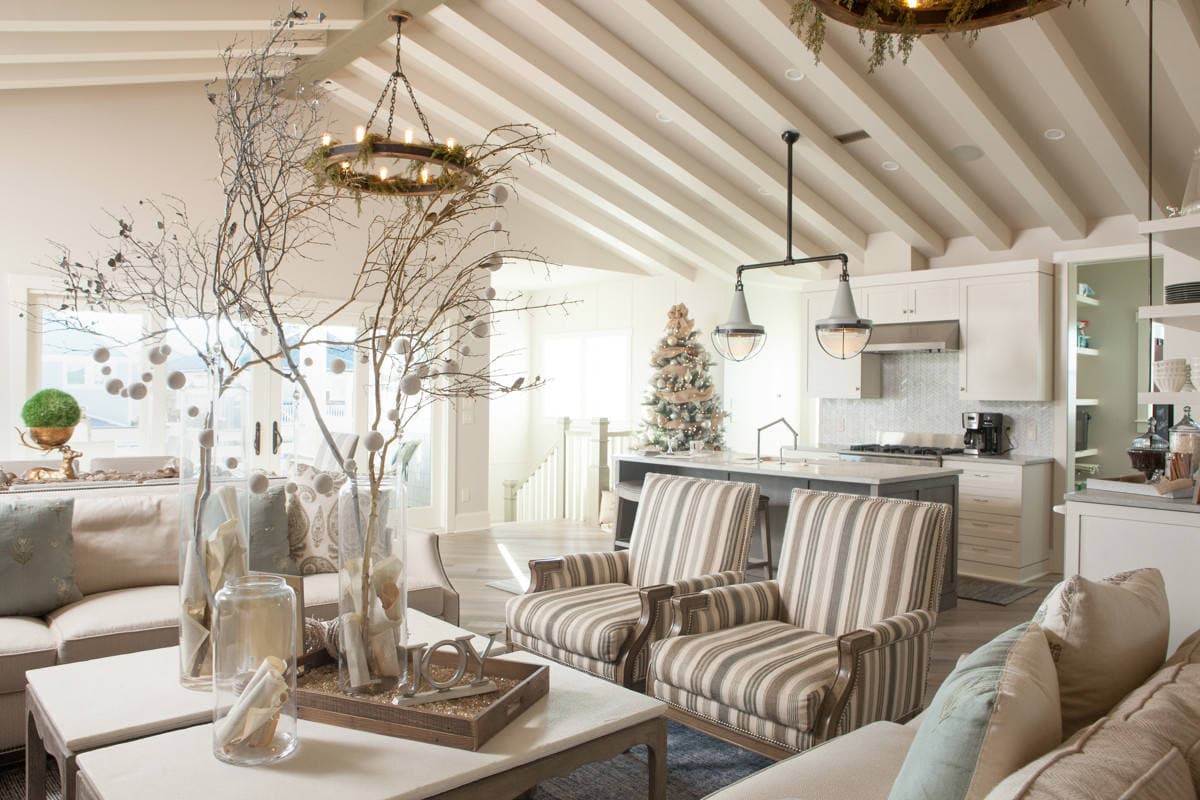 Example of cozy Christmas decor featuring living room decorated in coastal style.