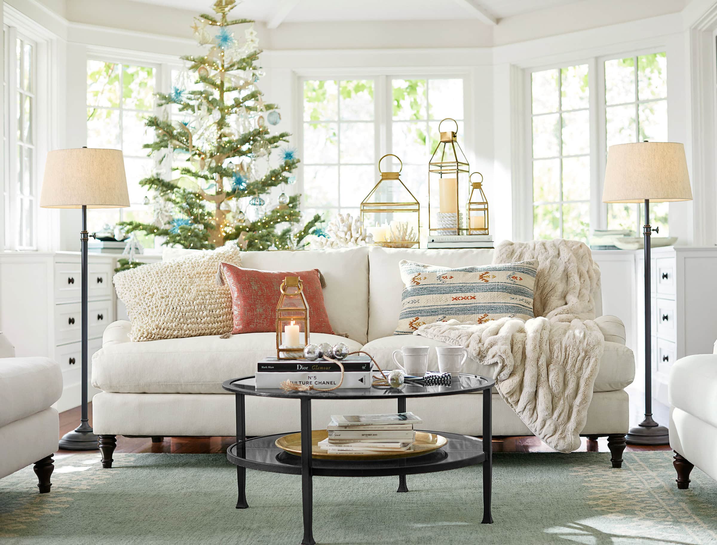 Example of cozy Christmas decor featuring living room decorated in coastal style.