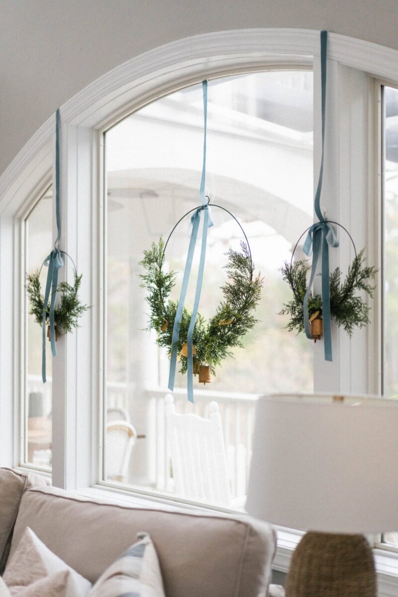 Example of cozy Christmas decor featuring living room decorated in coastal style.