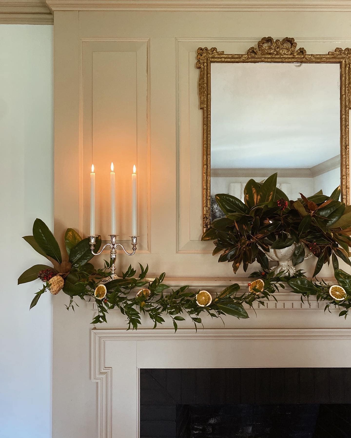 Example of cozy Christmas decor featuring living room decorated in traditional style.