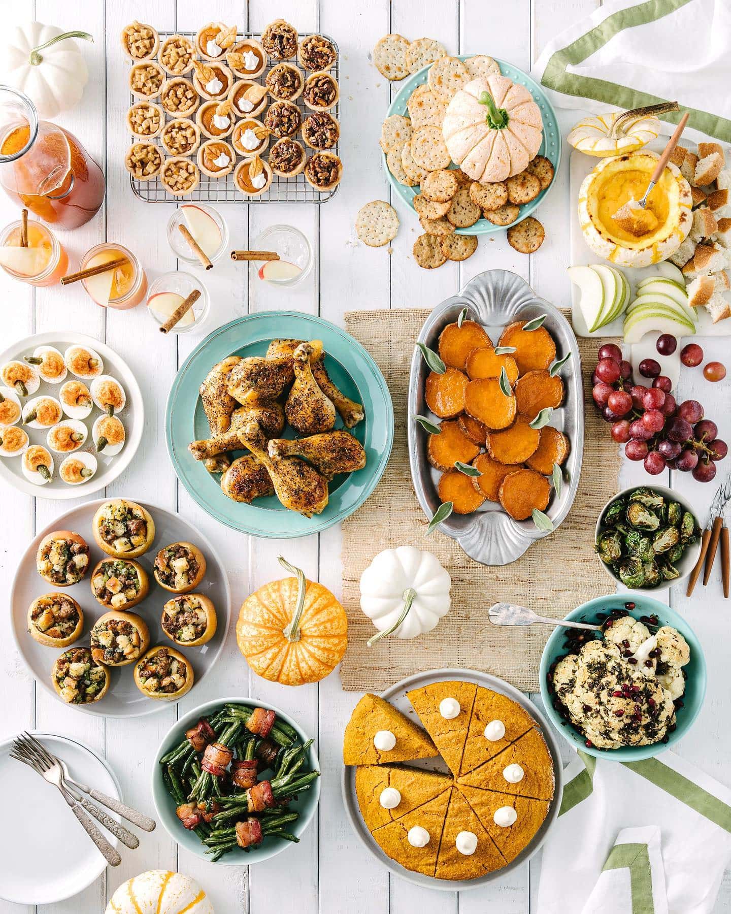 Friendsgiving Aesthetic inspiration idea featuring a cozy table setting with buffet food