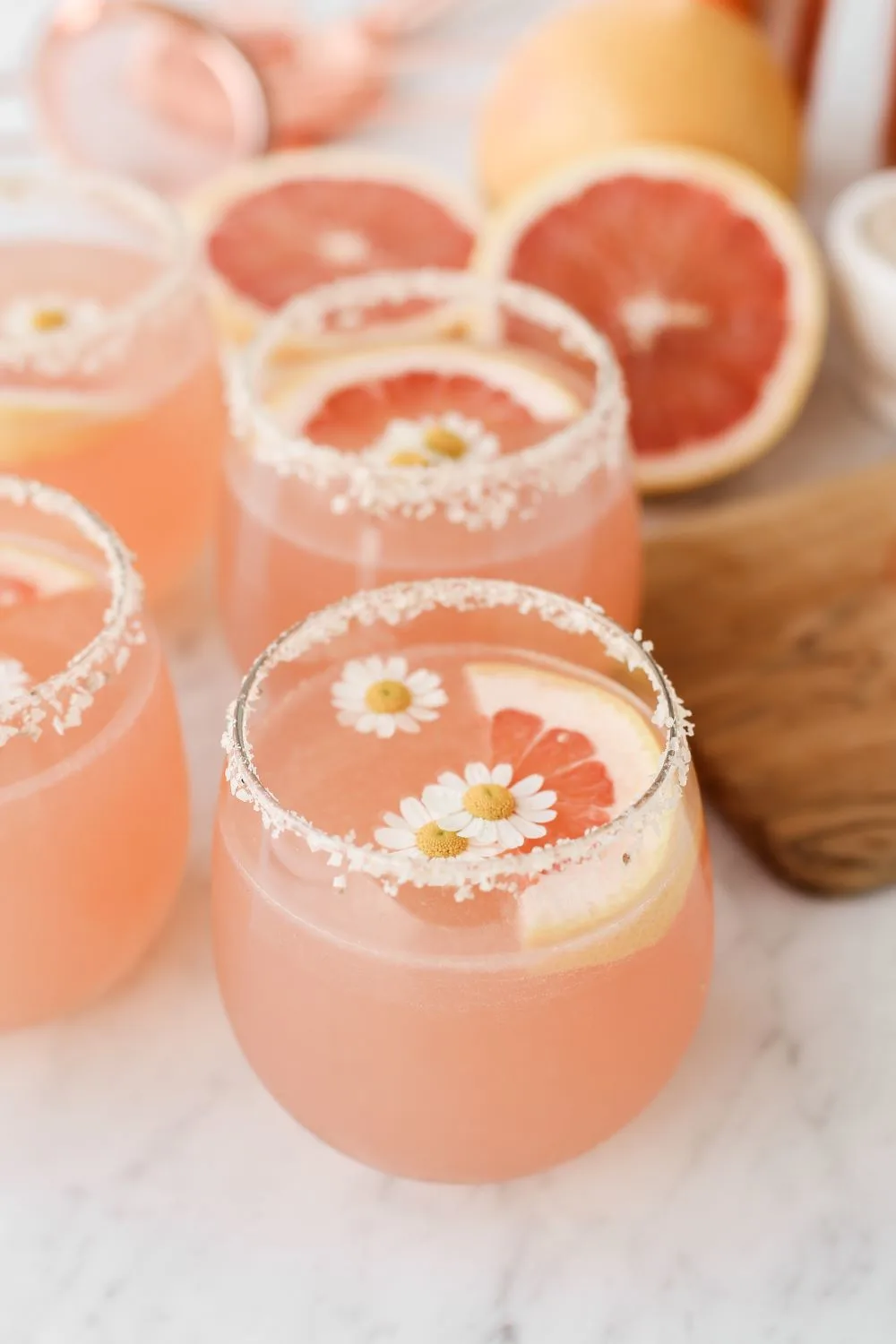 Friendsgiving Aesthetic inspiration idea featuring a cozy table setting with pink mocktails