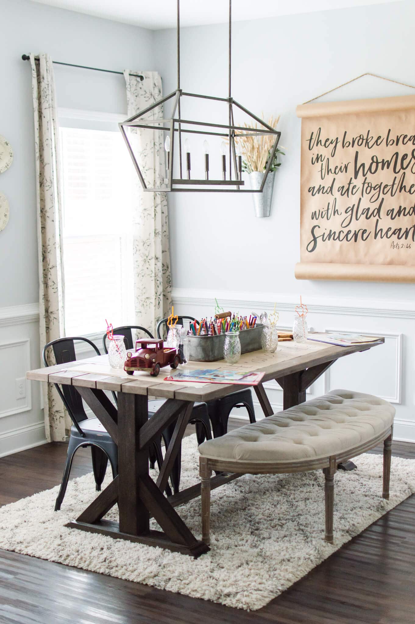 Thanksgiving kids table fun decor idea featuring paper banner behind table set