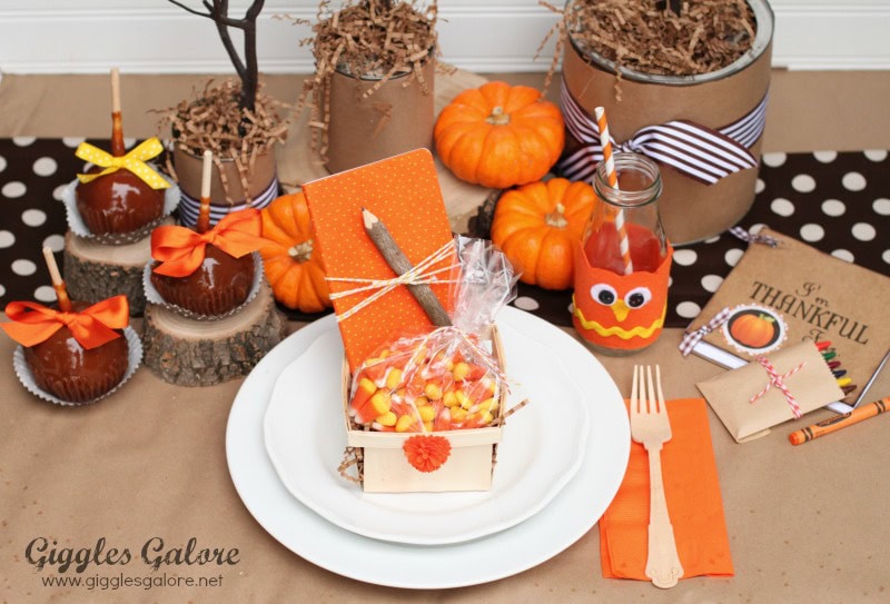 Thanksgiving kids table fun decor idea featuring orange and black color scheme