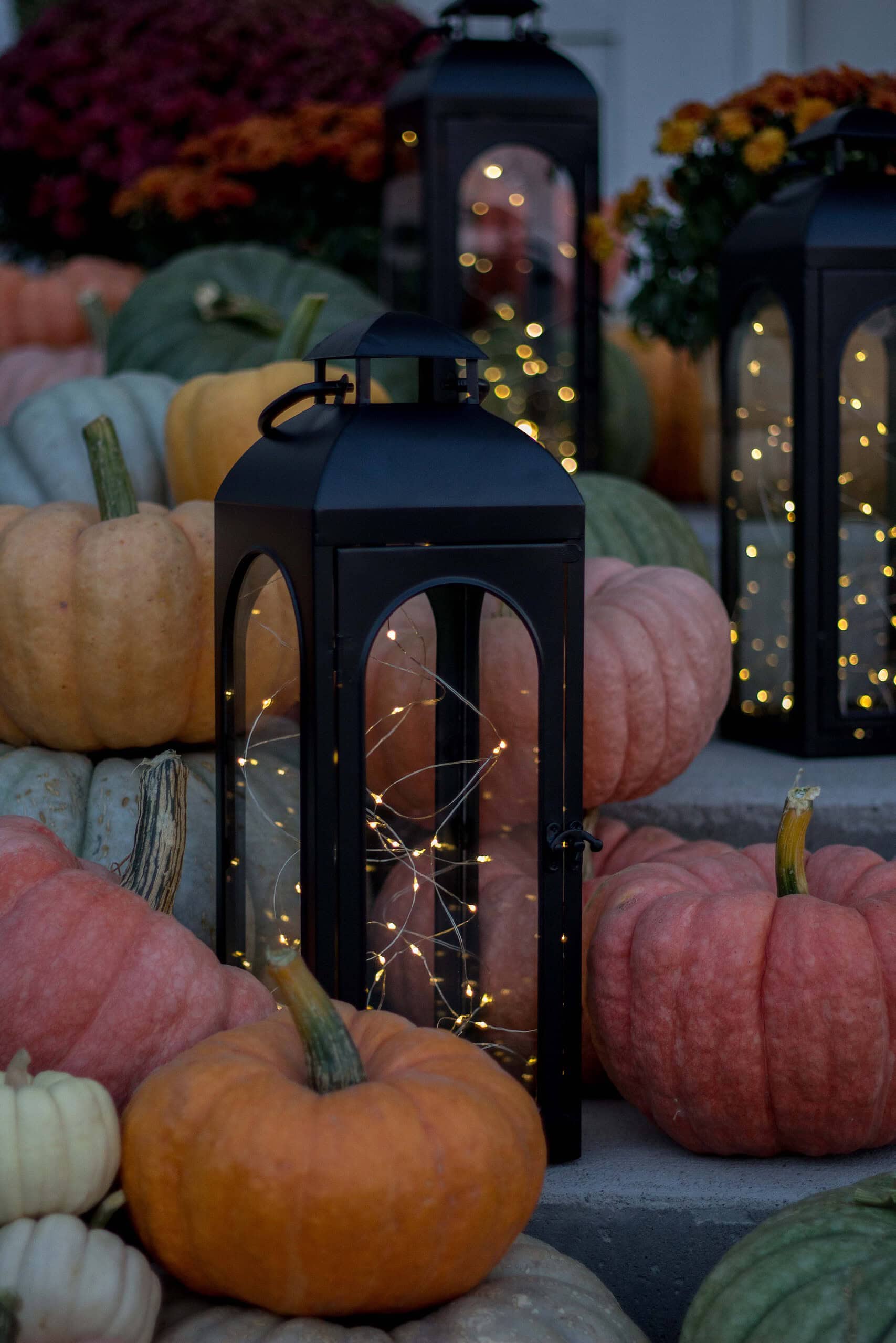 How to decorate for Thanksgiving example featuring lantern filled with fairy lights