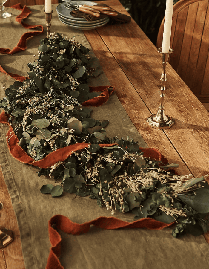 How to decorate for Thanksgiving example featuring warm color scheme table set up