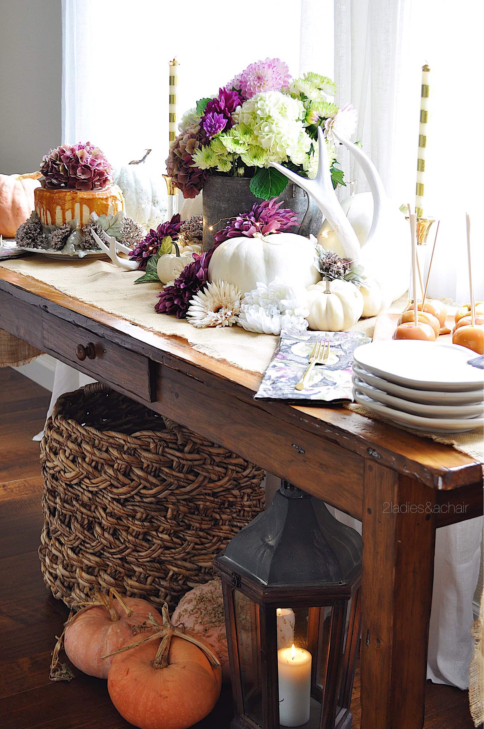 Thanksgiving buffet setup example featuring a traditional buffet with decorative florals and pumpkins