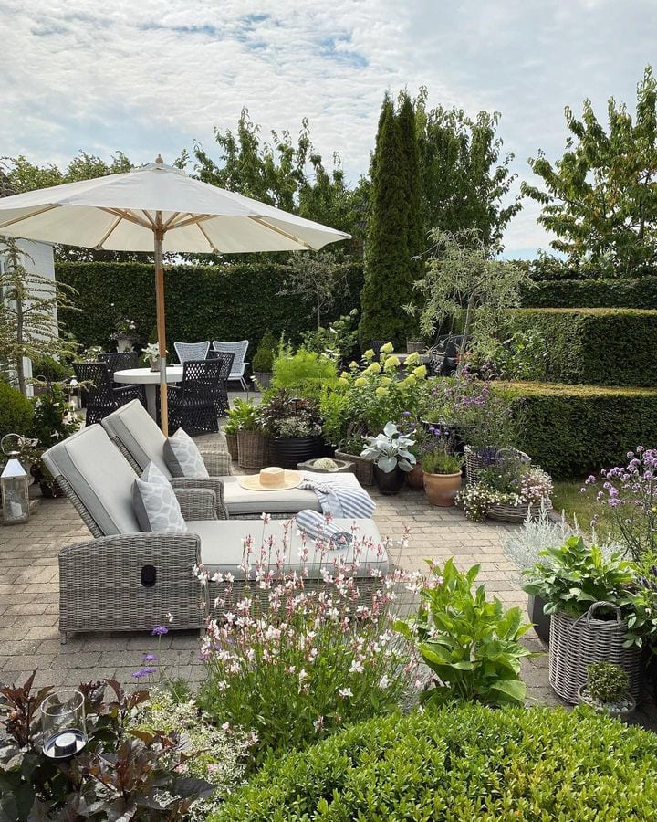 Patio furniture inspo featuring a lounging chairs in traditional patio garden style