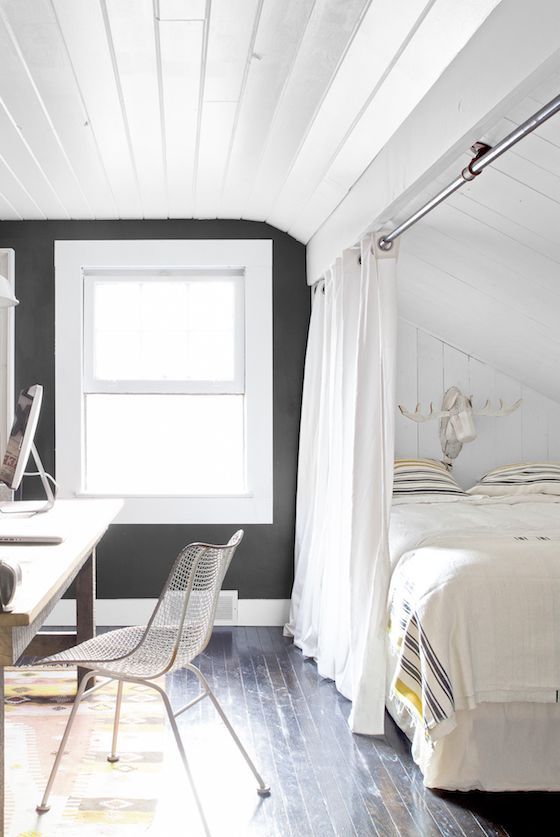 Guest room inspiration example showcasing a home office with a bed next to the desk