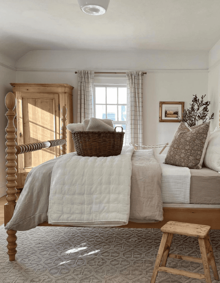 Bedroom decorated for fall and winter featured as an example of seasonal bedding swaps