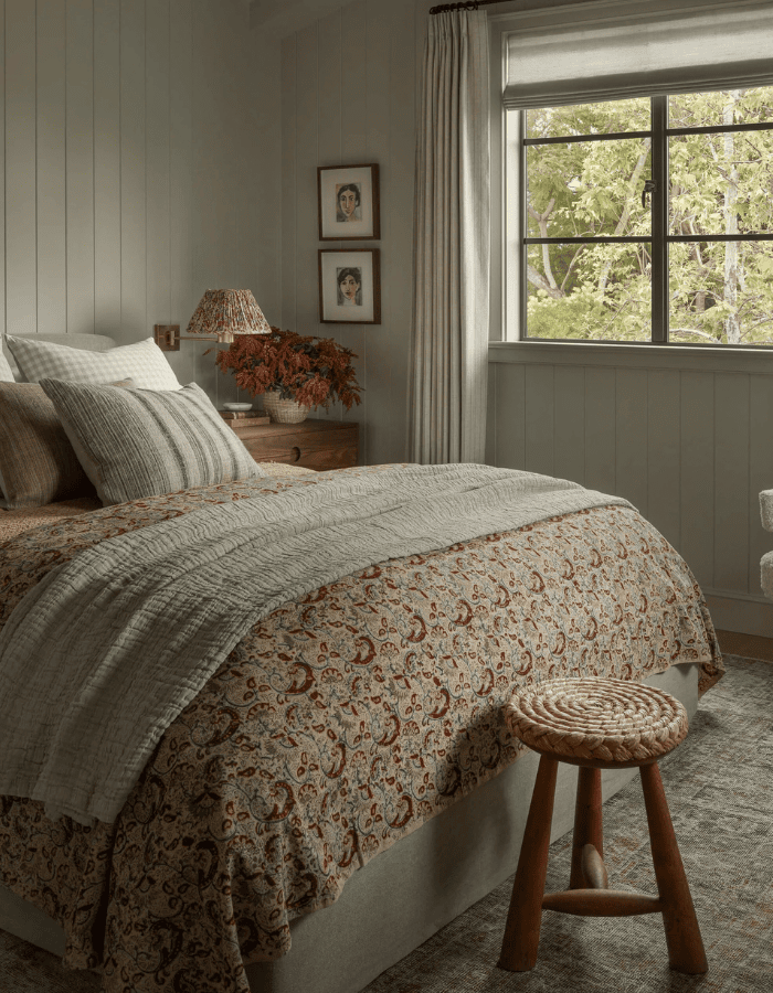 Bedroom decorated for fall and winter featured as an example of seasonal bedding swaps
