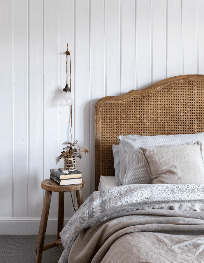 Bedroom decorated for fall and winter featured as an example of seasonal bedding swaps