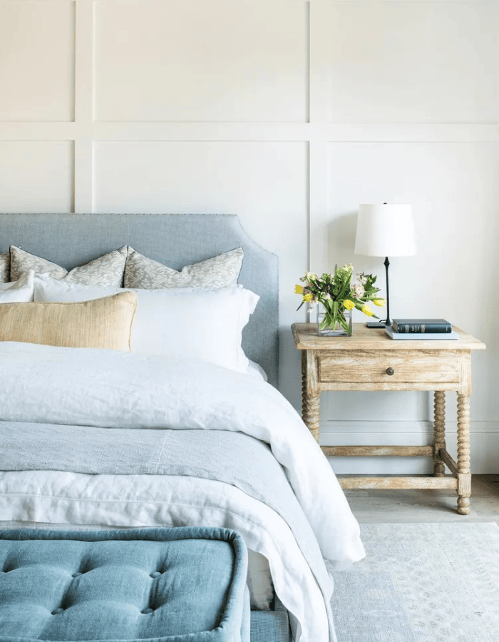 Bedroom decorated for fall and winter featured as an example of seasonal bedding swaps