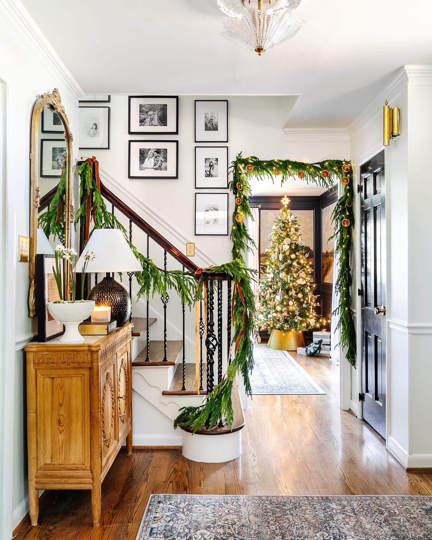 Christmas staircase decor idea featuring a simple whispy green garland