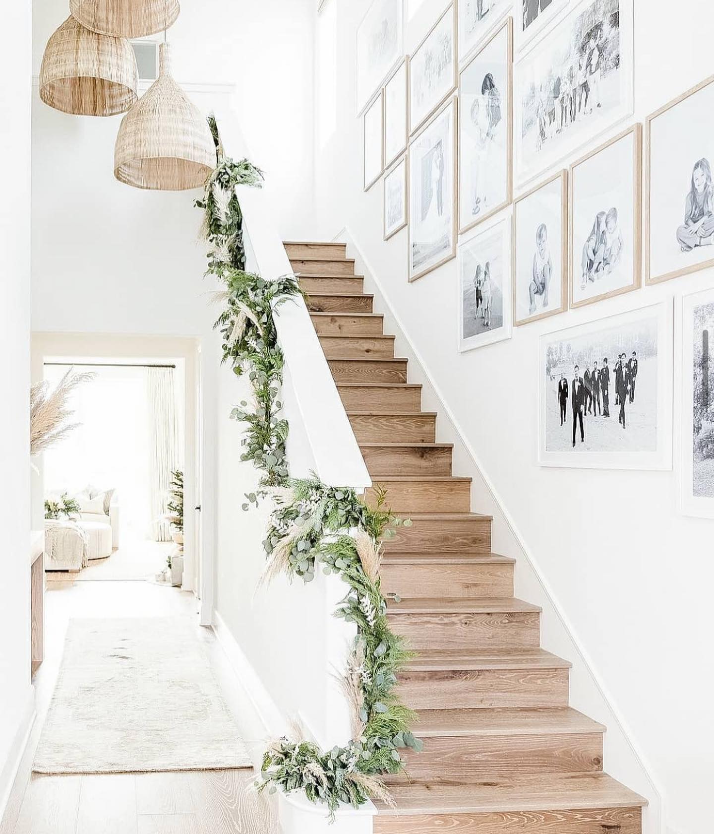 Christmas staircase decor idea featuring a simple whispy green garland