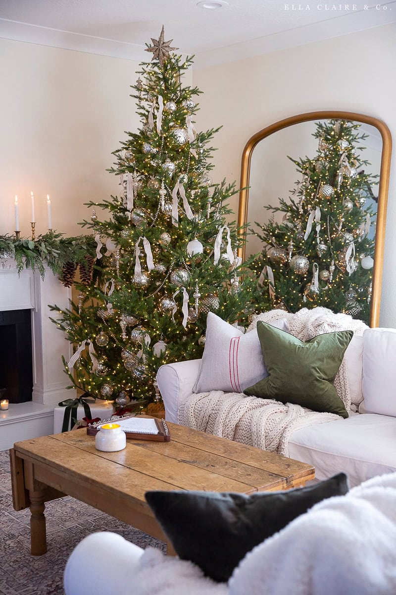 Nostalgic holiday decor idea featuring vintage Christmas tree with victorian inspired ornaments in green and white