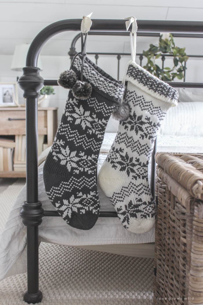 Christmas Stocking Holder Ideas for a Cozy Display Without a Fireplace featuring a stockings hanging from bed frame in shabby style