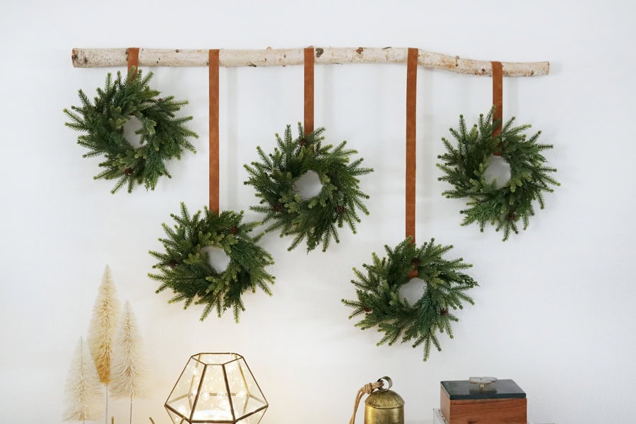 Christmas Wreath idea featuring a gallery wall featuring wreaths hanging from a branch