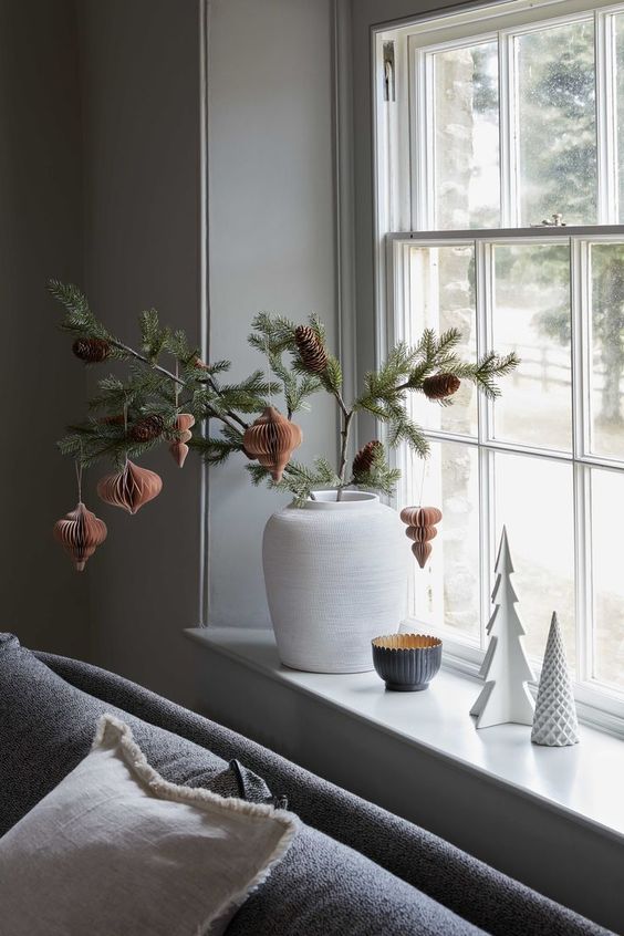 vignette showcasing transition from Thanksgiving to Christmas decor featuring seasonal floral arrangement