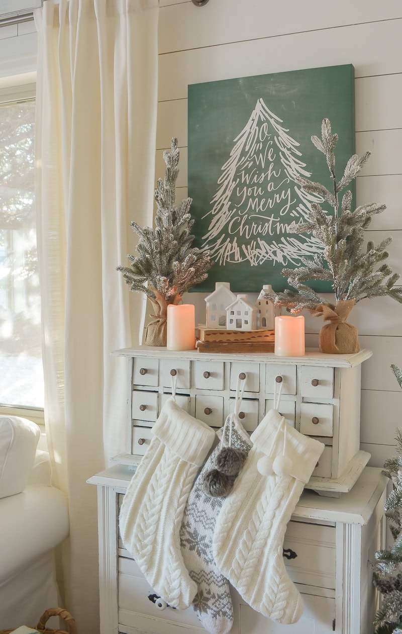 Christmas Stocking Holder Ideas for a Cozy Display Without a Fireplace featuring a stockings hanging from drawer in shabby style