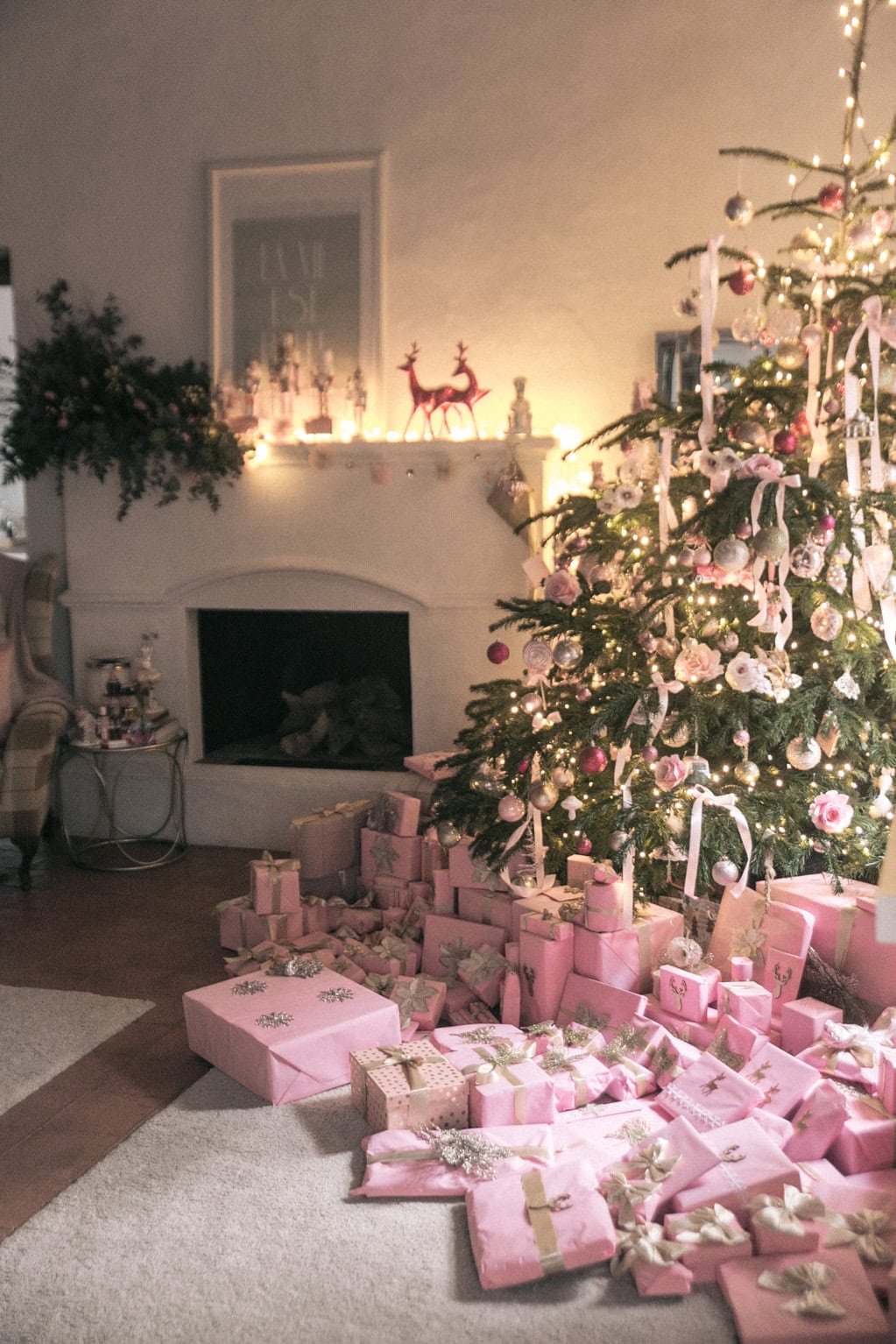 Pink Christmas Decorations inspiration, showcasing a retro inspired Christmas tree with a soft pink ribbons and wrapped gift boxes