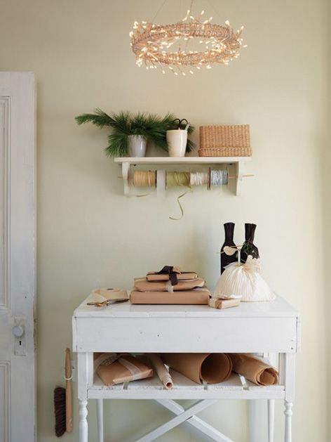 Gift wrapping station ideas for the holidays featuring a wrapping organization side table