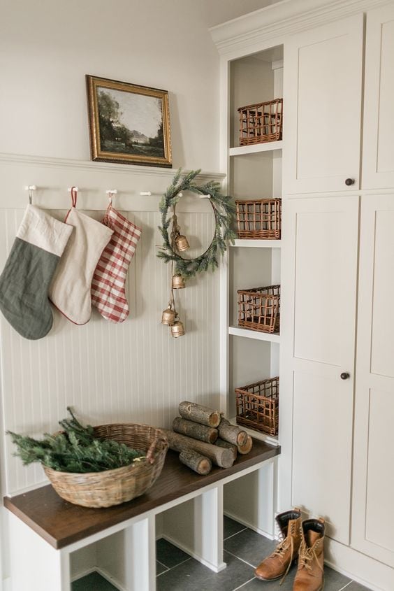 foyer showcasing transition from Thanksgiving to Christmas decor featuring a traditional style entryway