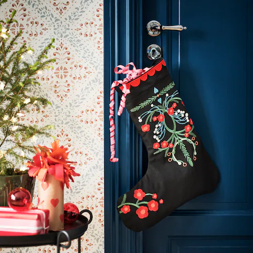 Christmas Stocking Holder Ideas for a Cozy Display Without a Fireplace featuring a stockings hanging from door in retro colorful style