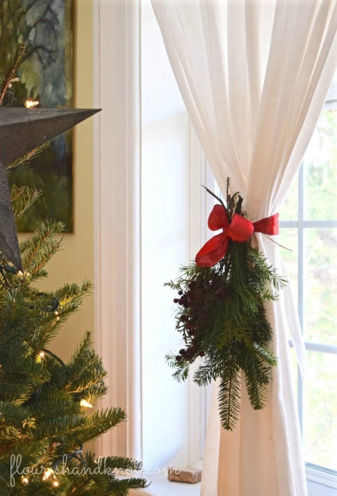 transition from Thanksgiving to Christmas decor example showcasing curtains held by a Christmas themed tie