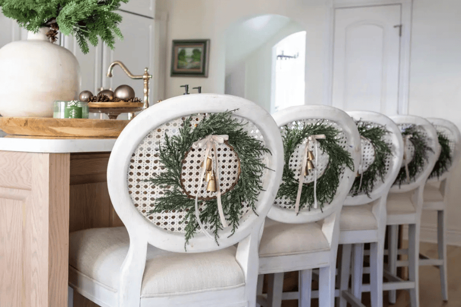 Christmas Wreath idea featuring the back chairs with hang wreath