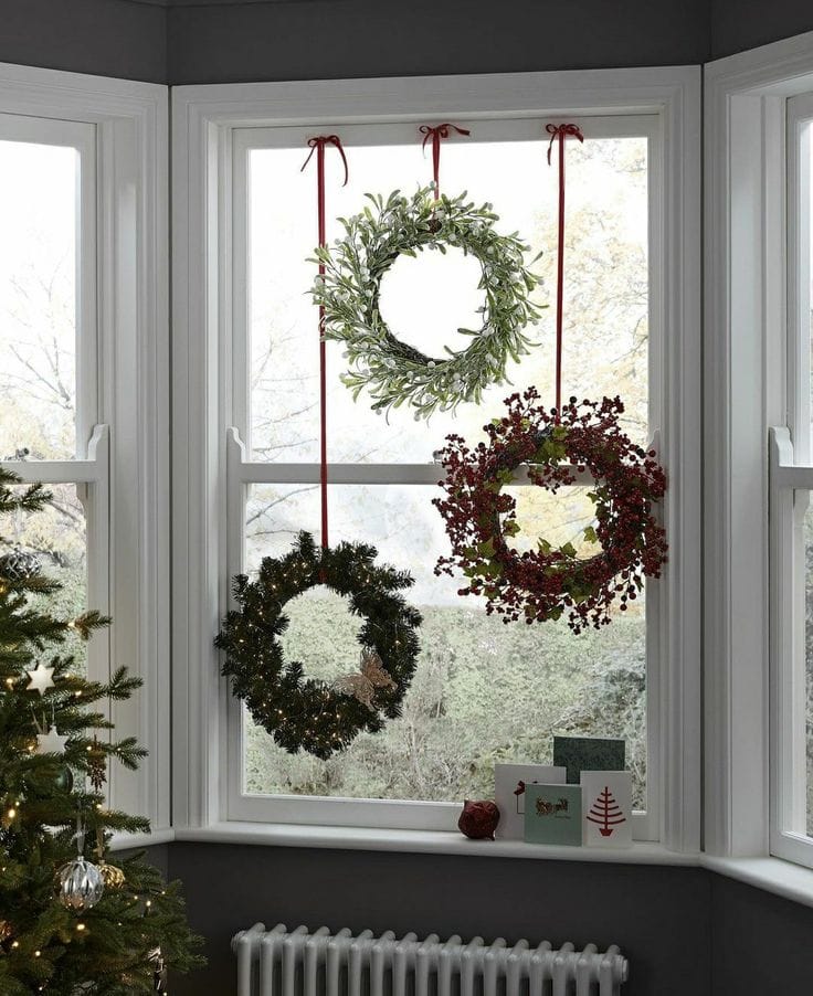 Christmas Wreath idea featuring a wreath against a window