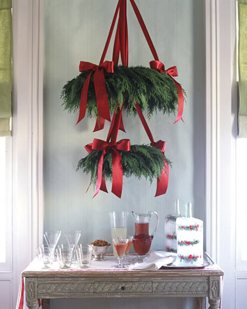 Christmas Wreath idea featuring 2 wreaths used as chandelier in a traditional style