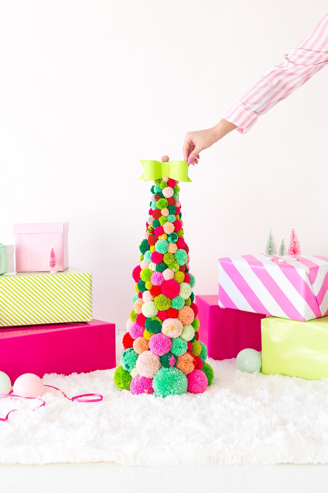 Kid-friendly Christmas decor ideas example featuring a colorful pom pom DIY Christmas tree