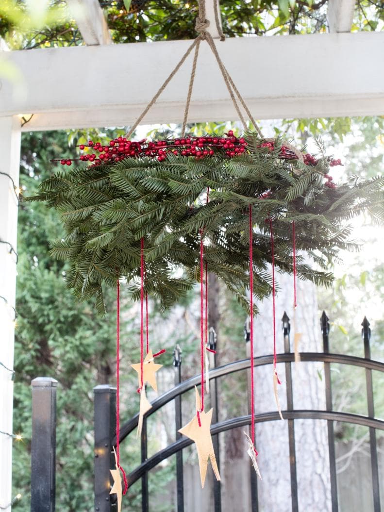 Christmas Wreath idea featuring a wreath used as chandelier in a traditional style
