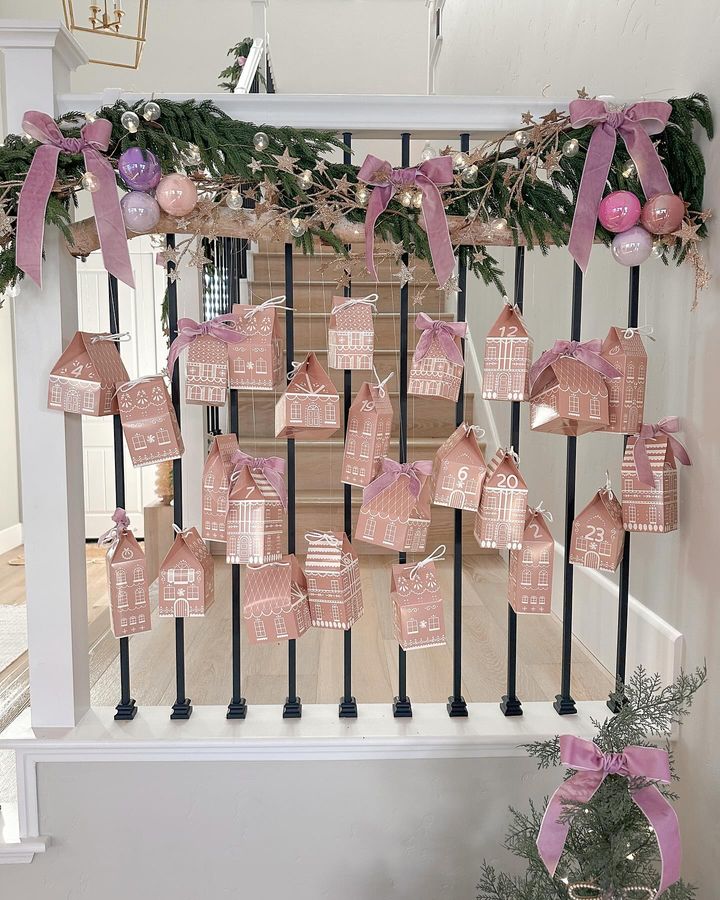 Pink Christmas Decorations inspiration, showcasing paper house advent vignette in soft muted pink