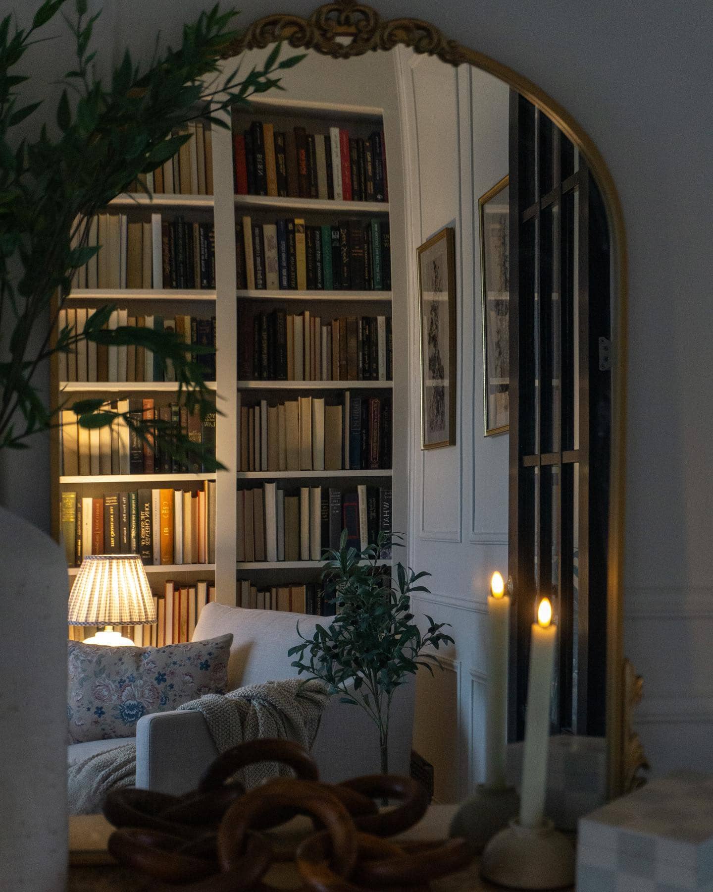 Home library showcasing transition from Thanksgiving to Christmas decor with a traditional vignette