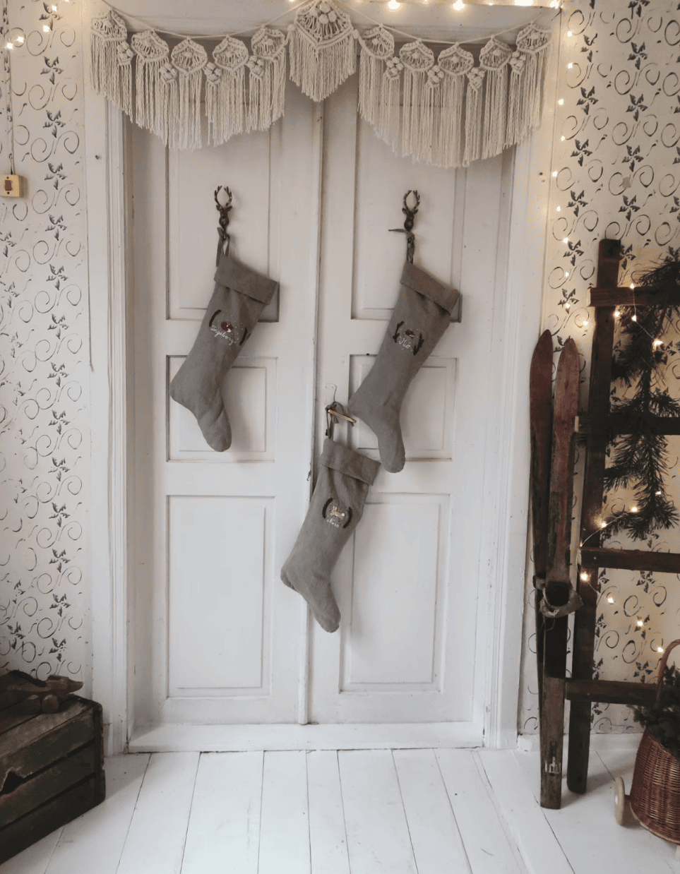 Christmas Stocking Holder Ideas for a Cozy Display Without a Fireplace featuring a stockings hanging from doors in vintage inspired holiday style