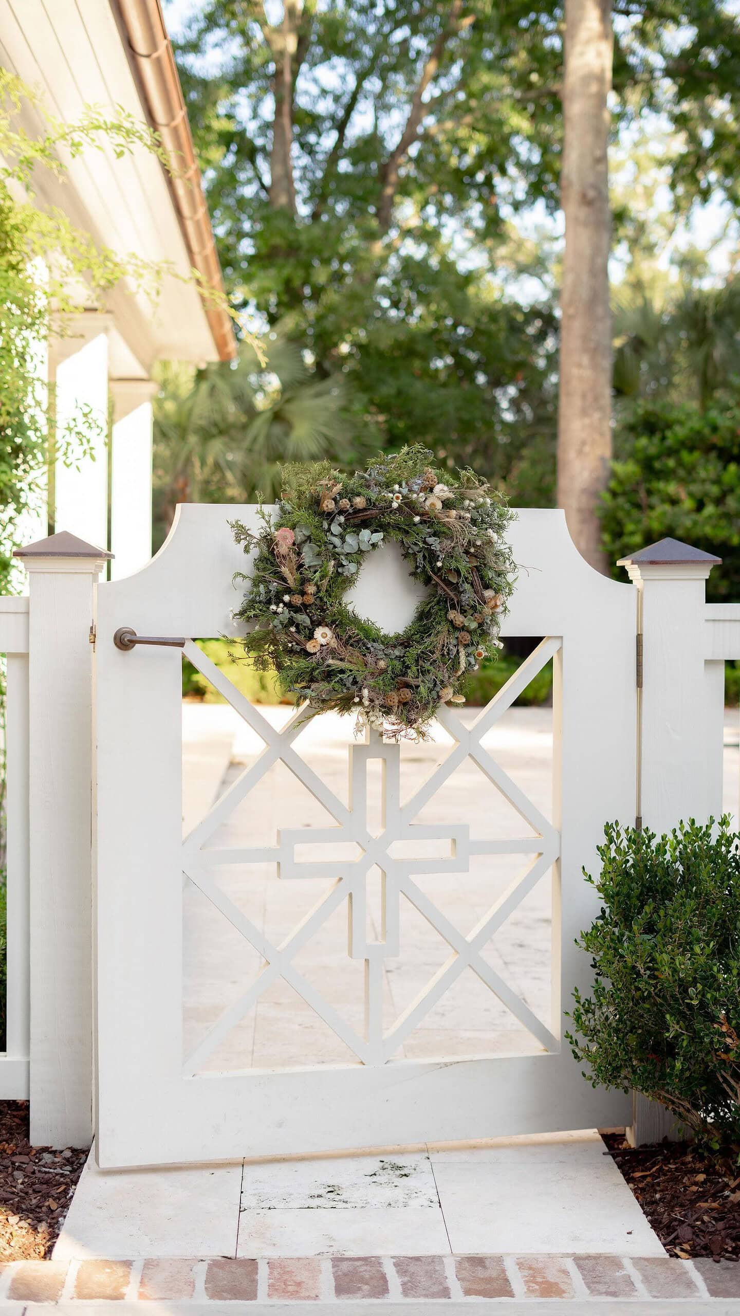 Christmas Wreath idea featuring wreath hung on gate