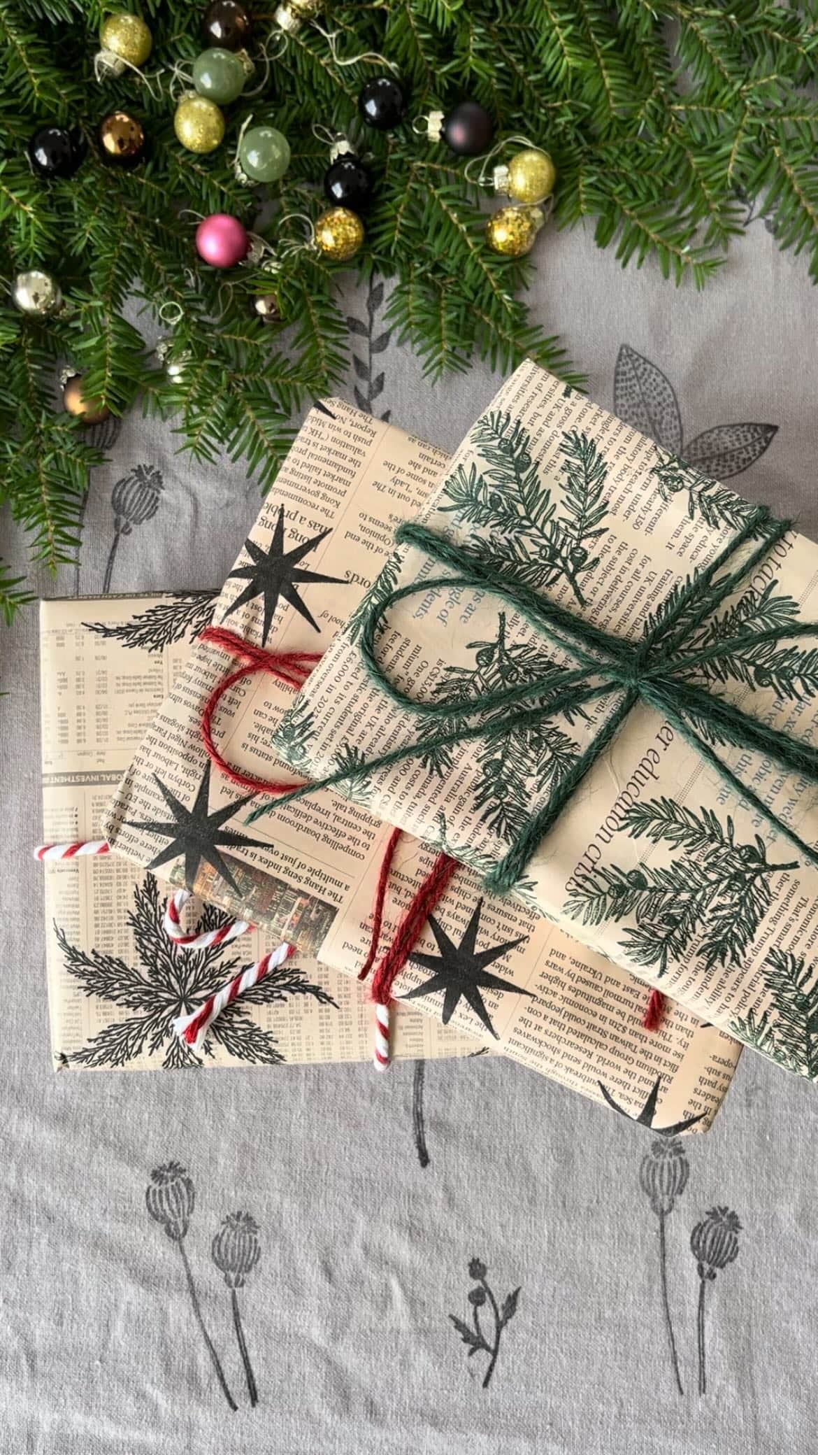 Example of the Gift Wrapping Aesthetic Trend featuring DIY organic style with newspaper and stamps