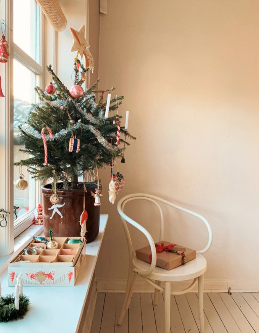 Kid-friendly Christmas decor ideas example featuring a evergreen Christmas potted tree