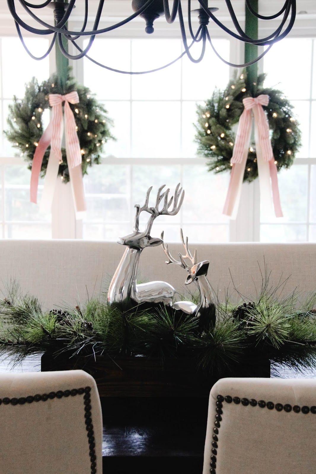 Pink Christmas Decorations inspiration, showcasing a salmon pink bows wrapped in wreaths