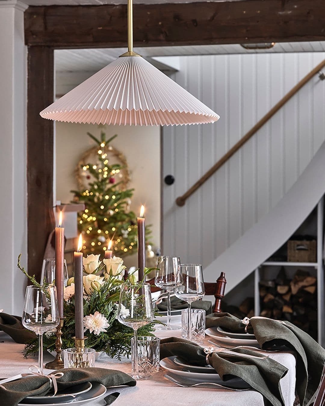 Dining room styled for Christmas with a traditional style table setup
