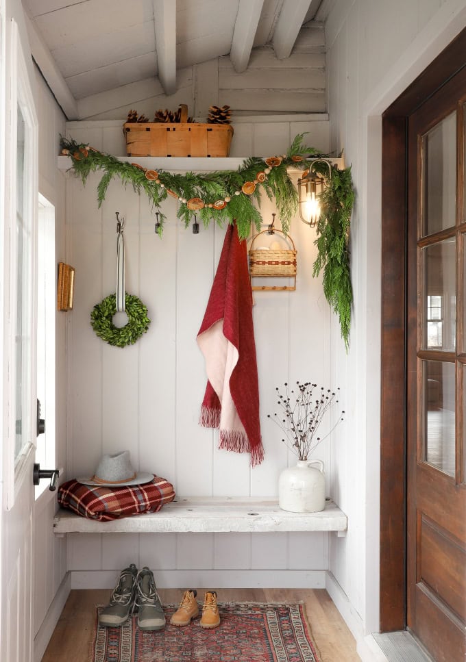 Holiday entryway idea featuring an foyer in traditional eclectic style