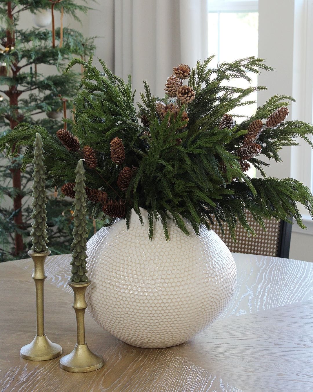 Kitchen vignette styled for Christmas with a greenery inside a farmhouse vase