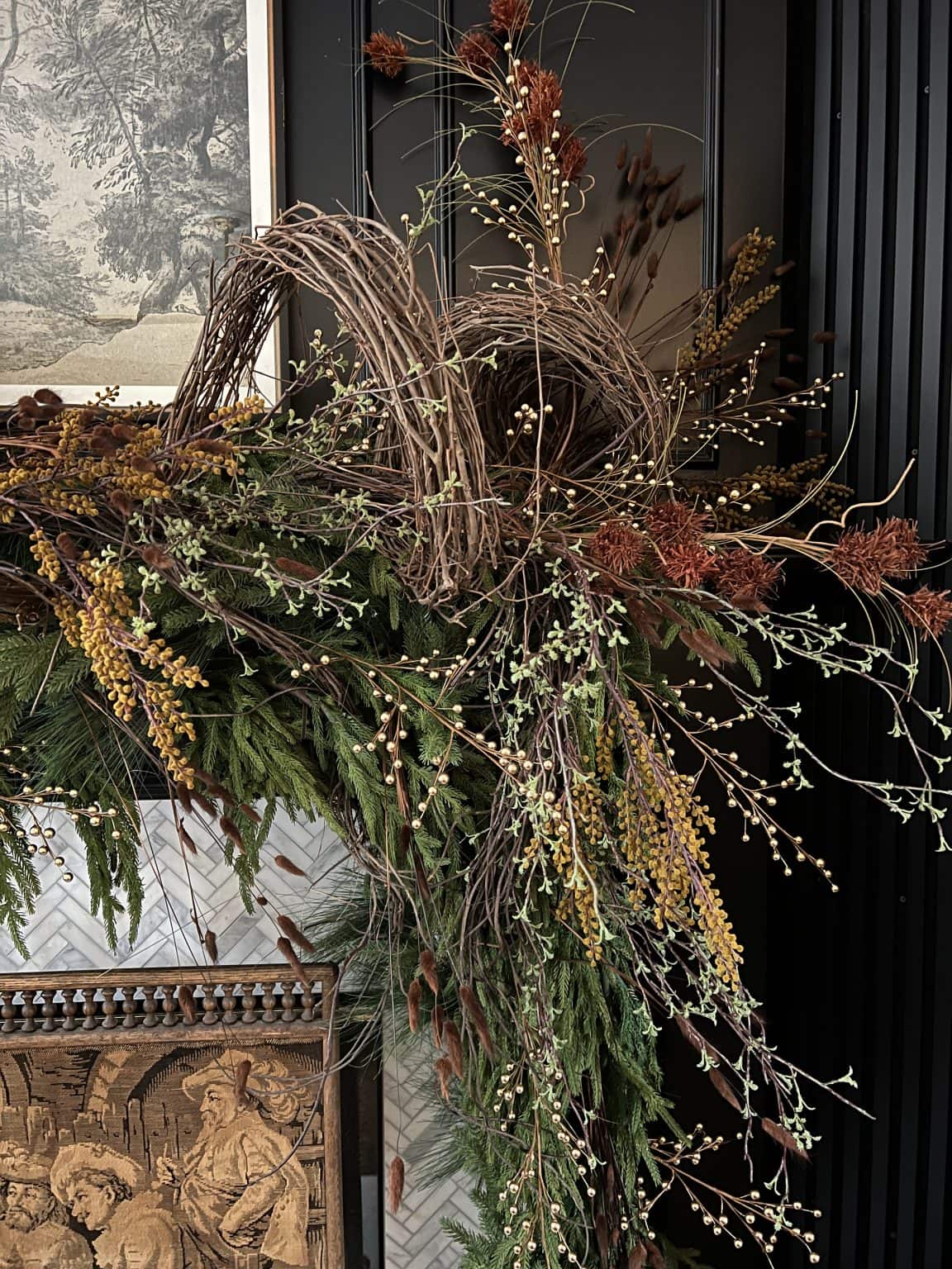 Vignette showcasing transition from Thanksgiving to Christmas decor with a floral arrangement
