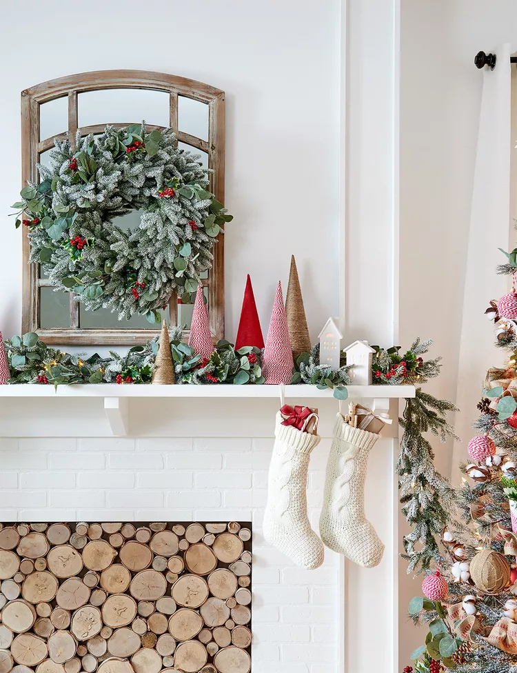 Example of Christmas mantel decor idea featuring a modern traditional look above a fireplace
