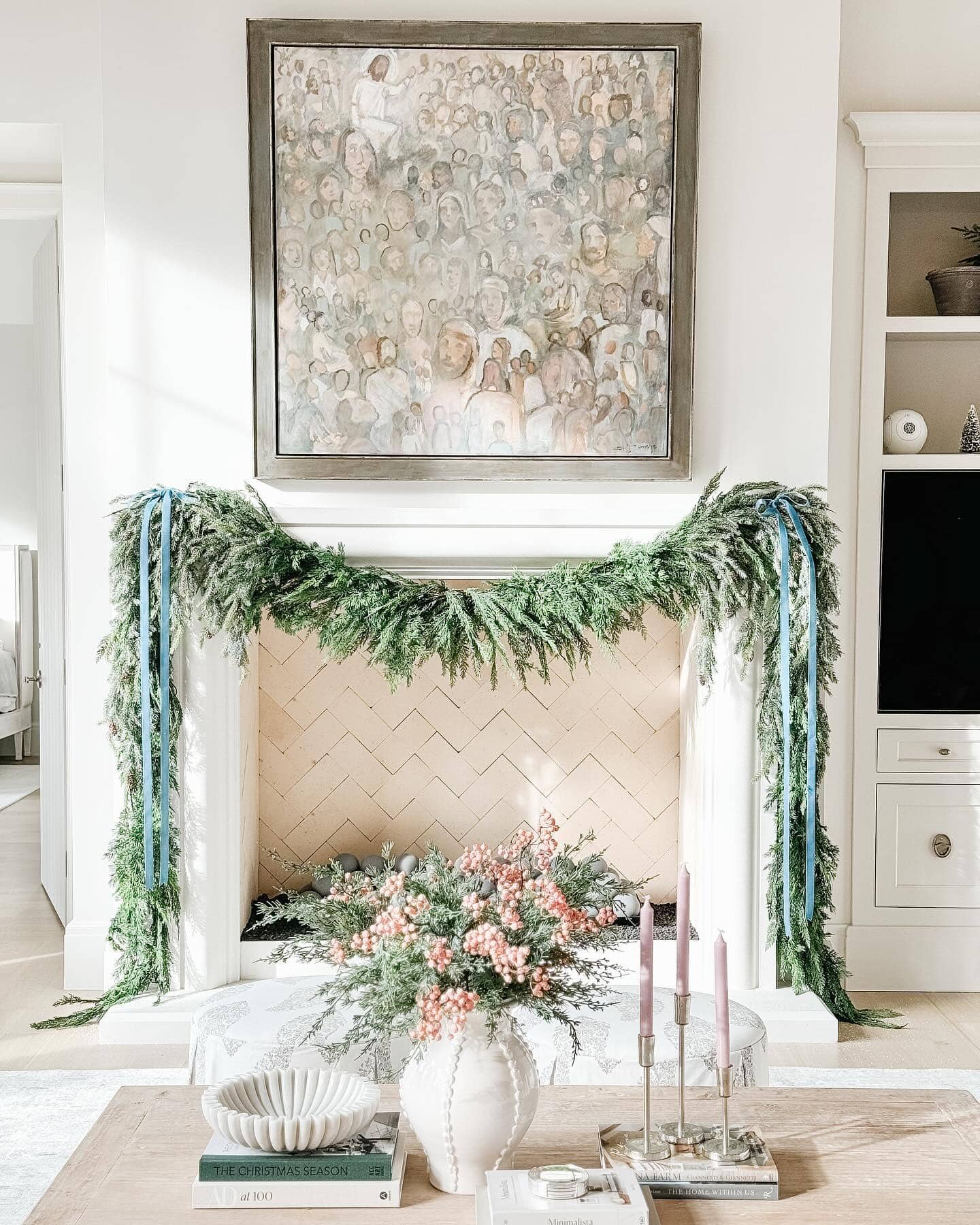 Example of Christmas mantel decor idea featuring a modern traditional look above a fireplace
